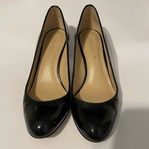 Coach patent pumps